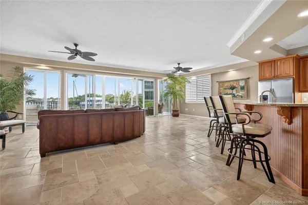 a bedroom with a bed and a dresser with wooden floor