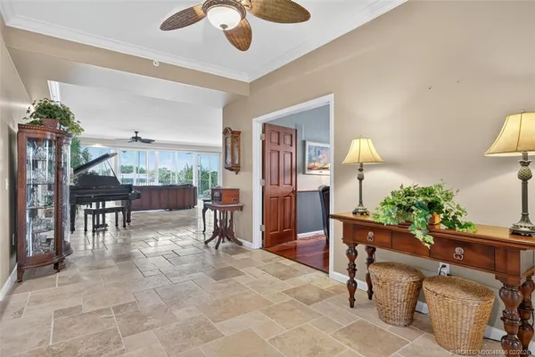 a bathroom with a granite countertop sink toilet a large mirror a shower and vanity