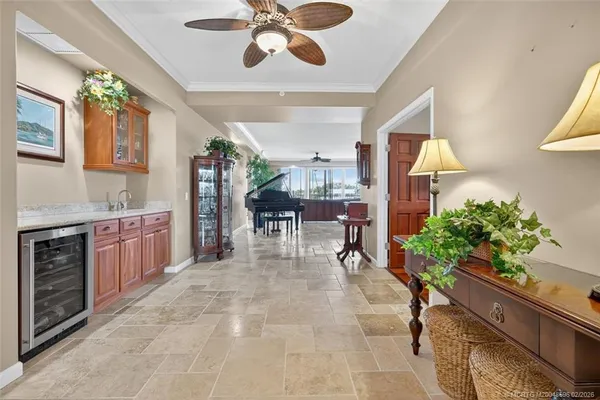 a large kitchen with cabinets table and chairs