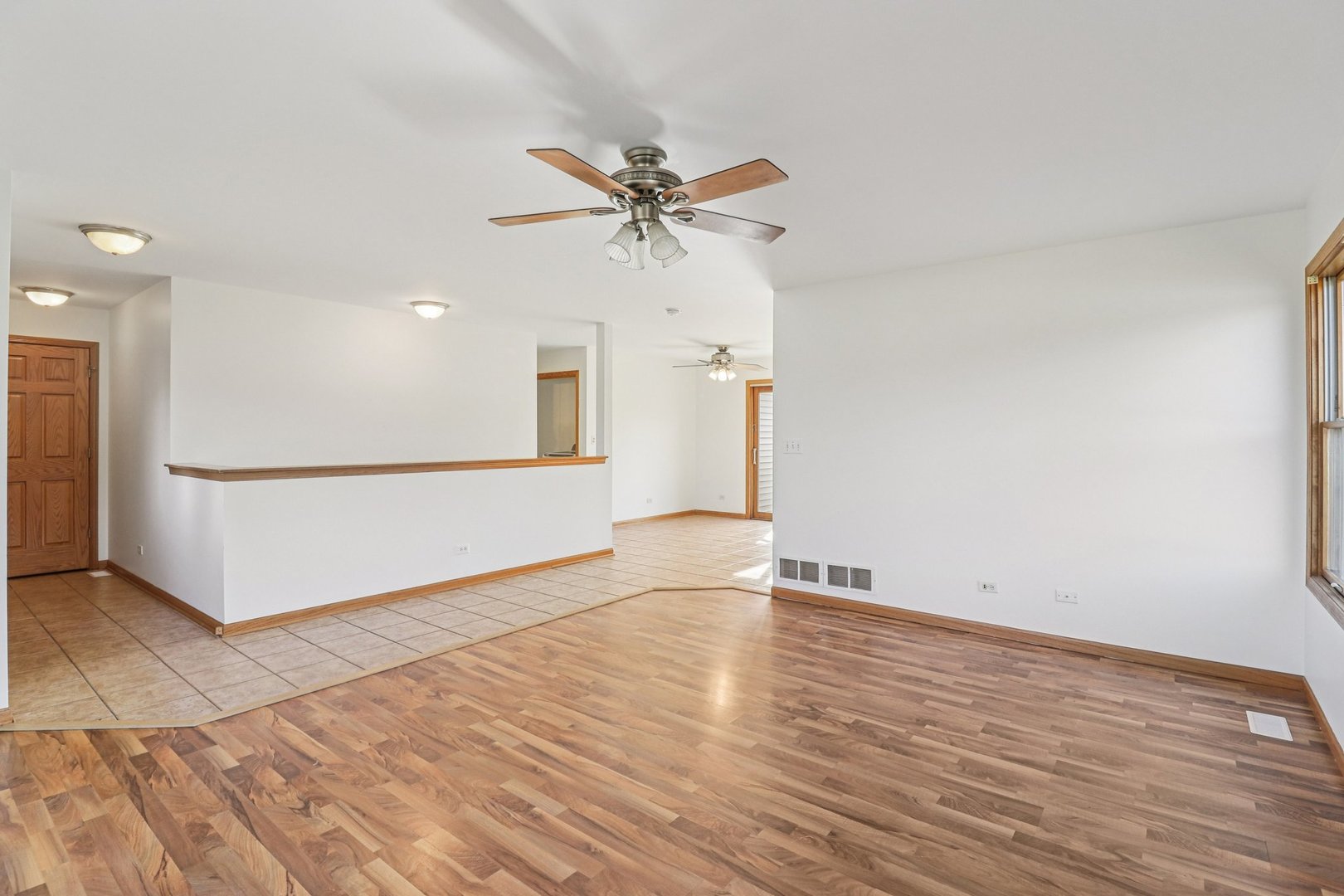 905 Randall Court Marengo, IL 60152 - Photo 12 of 28 wooden floor in an empty room with a window