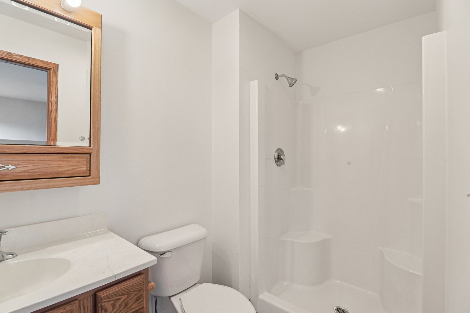 905 Randall Court Marengo, IL 60152 - Photo 14 of 28 a white toilet sitting next to a bathroom sink