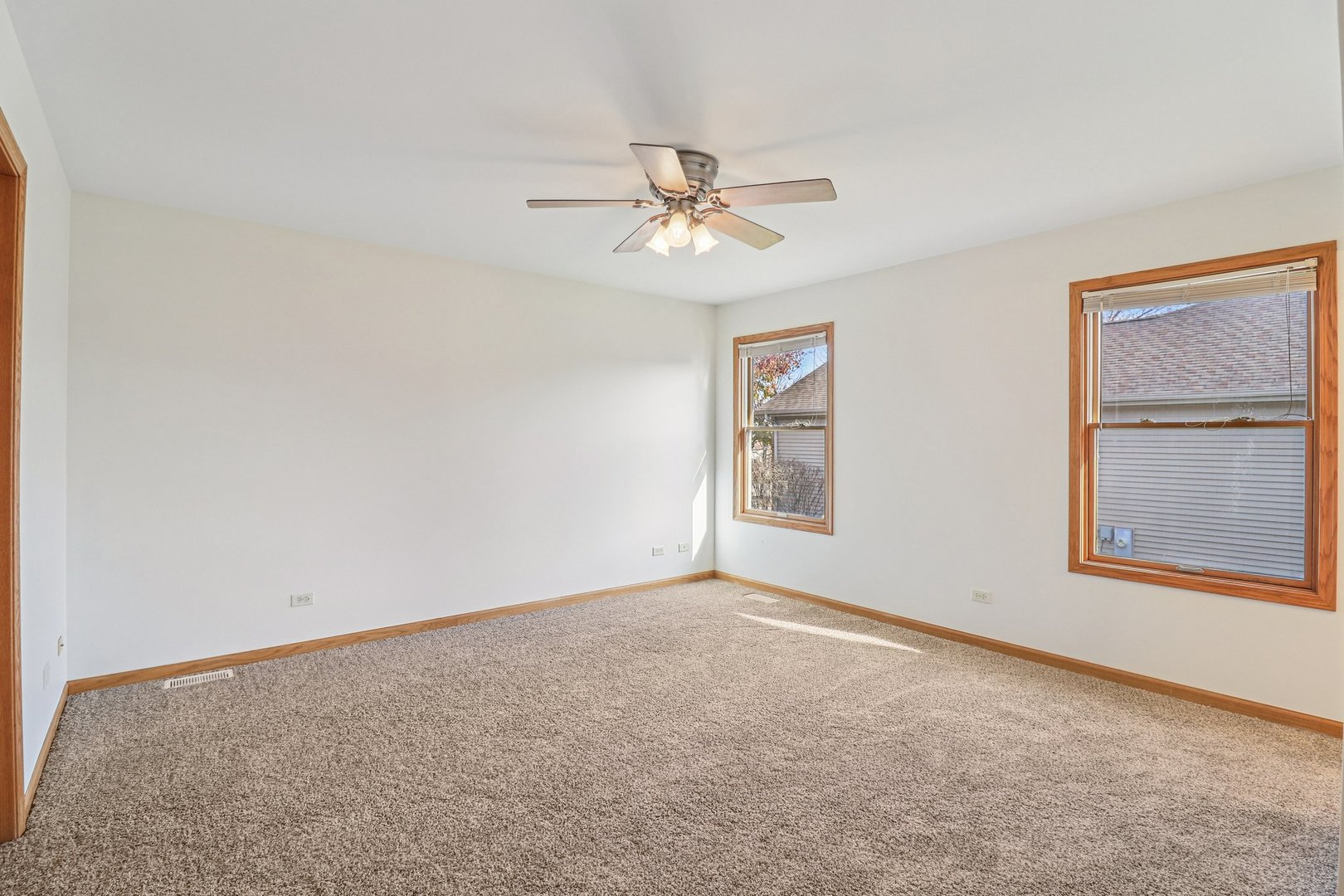905 Randall Court Marengo, IL 60152 - Photo 16 of 28 an empty room with windows and fan