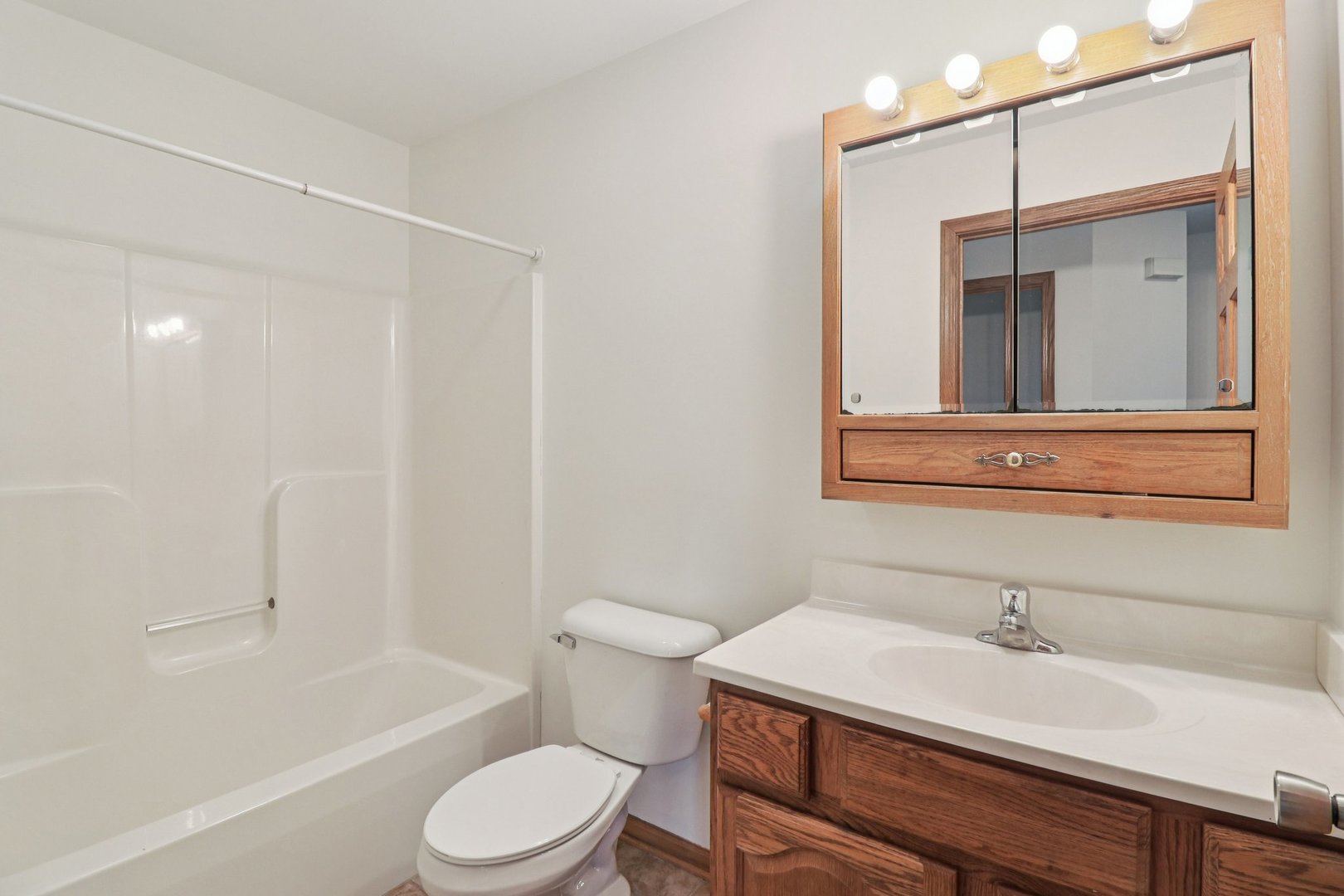 905 Randall Court Marengo, IL 60152 - Photo 17 of 28 a bathroom with a sink toilet vanity and shower