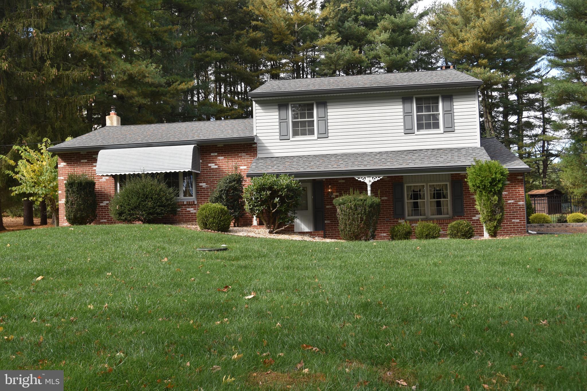 a view of a house with a yard and plants