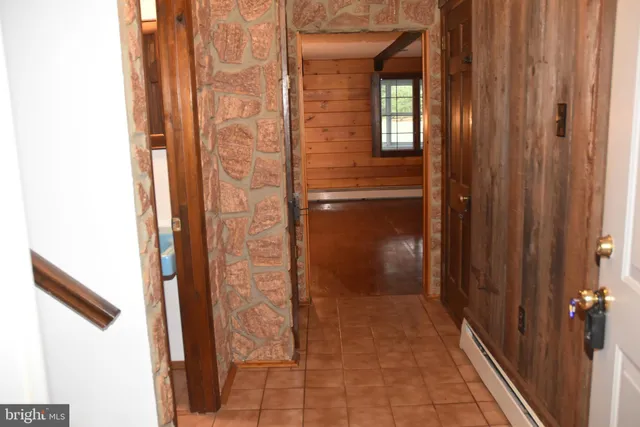 a bathroom with a sink a toilet and shower curtain