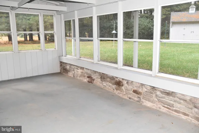 a kitchen with a refrigerator sink and cabinets