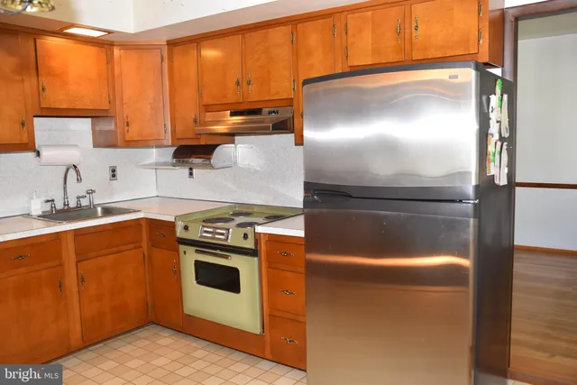 a bathroom with a bathtub and next to a window