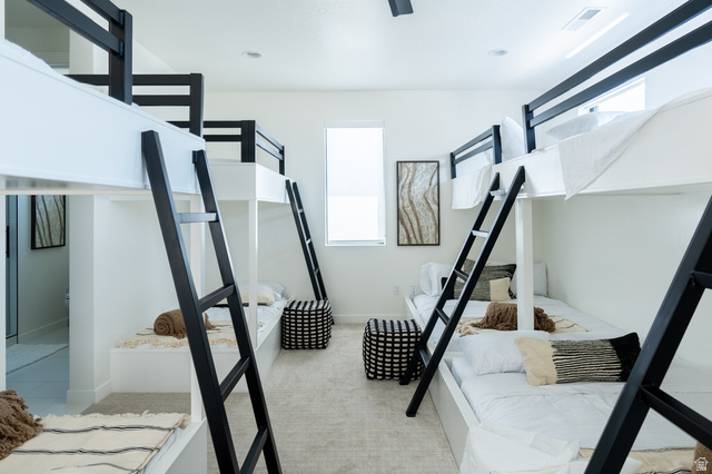 5355 Cyan Lane St. George, UT 84790 - Photo 34 of 39 Built-in bunk beds with black metal ladders, white walls, recessed lighting, and a single window