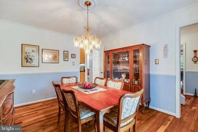 a kitchen with a table and chairs