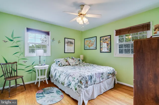 a bedroom with a bed and a dresser in it