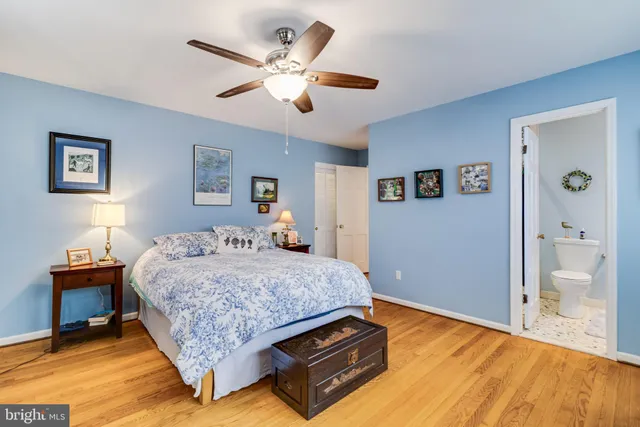 a house with wooden floor table and chairs