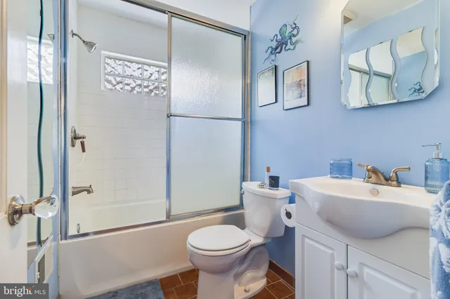 a view of swimming pool with outdoor seating and plants