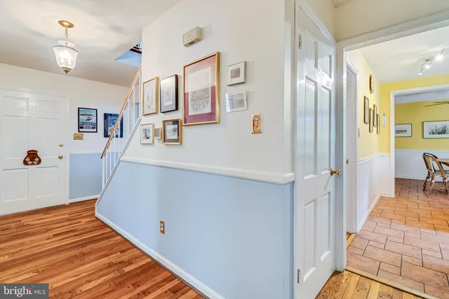 a view of barn with large tree in front of it