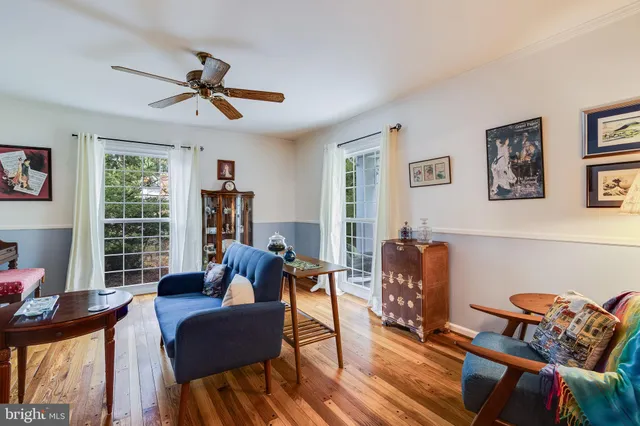 a living room with furniture fireplace and flat screen tv