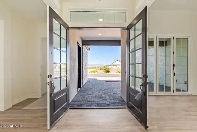 an empty room with windows and closet