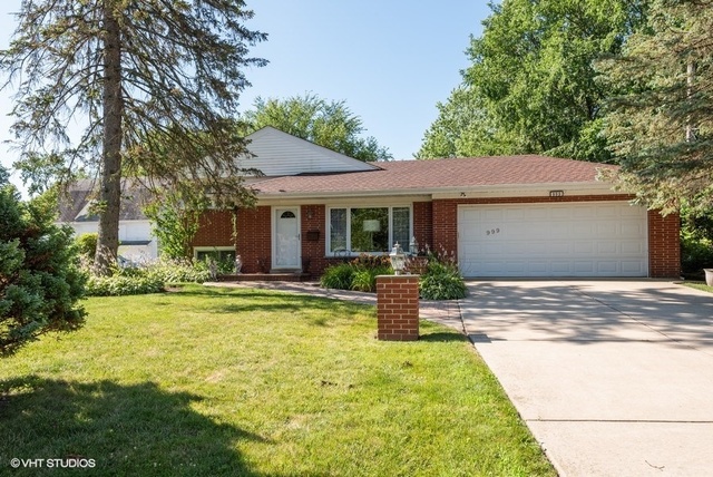 999 Shermer Road Northbrook, IL 60062 - Photo 1 of 17 a view of a house with backyard and sitting area