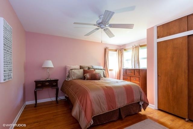 999 Shermer Road Northbrook, IL 60062 - Photo 11 of 17 a bedroom with a bed and a window