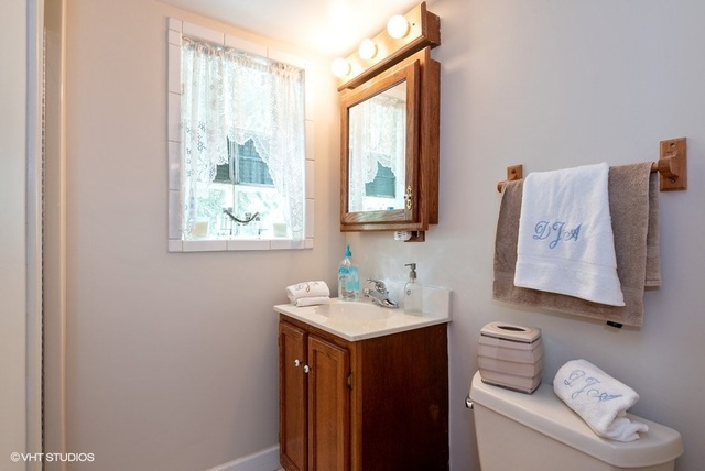 999 Shermer Road Northbrook, IL 60062 - Photo 14 of 17 a bathroom with a sink and a toilet