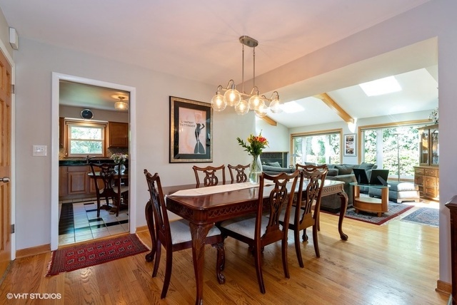 999 Shermer Road Northbrook, IL 60062 - Photo 3 of 17 a view of a dining room with furniture window and wooden floor