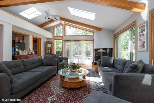 999 Shermer Road Northbrook, IL 60062 - Photo 4 of 17 a living room with furniture and a large window
