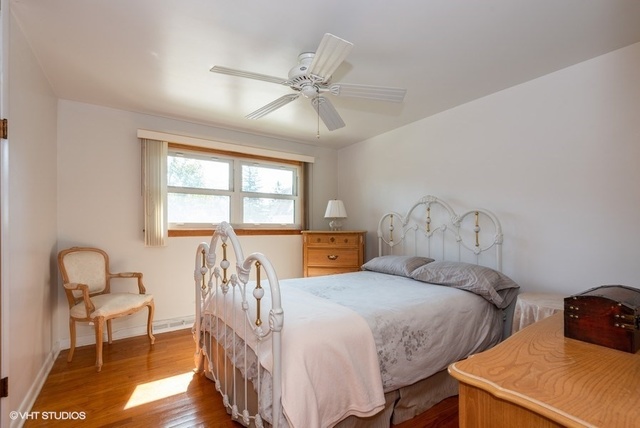 999 Shermer Road Northbrook, IL 60062 - Photo 10 of 17 a bedroom with two beds and a window