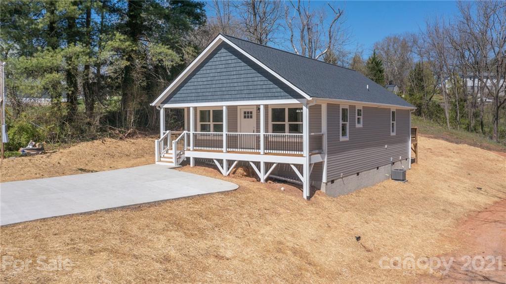 5 Sharptown Road Canton, NC 28716 - Photo 2 of 22 a view of a house with a yard and wooden fence
