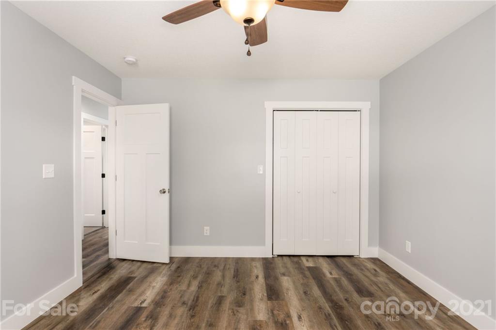 5 Sharptown Road Canton, NC 28716 - Photo 16 of 22 a view of an empty room with a ceiling fan