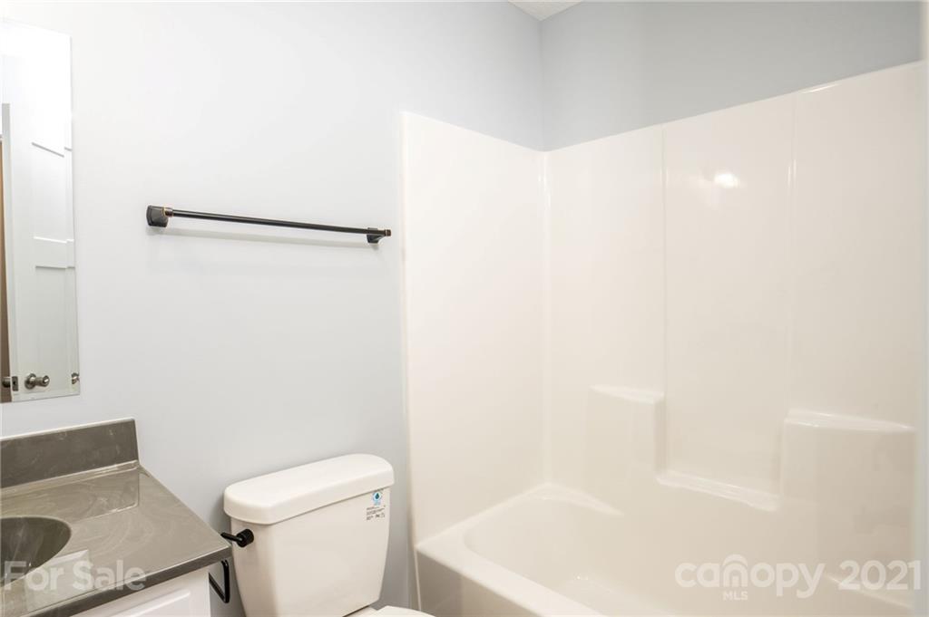5 Sharptown Road Canton, NC 28716 - Photo 20 of 22 a white toilet sitting next to a white sink