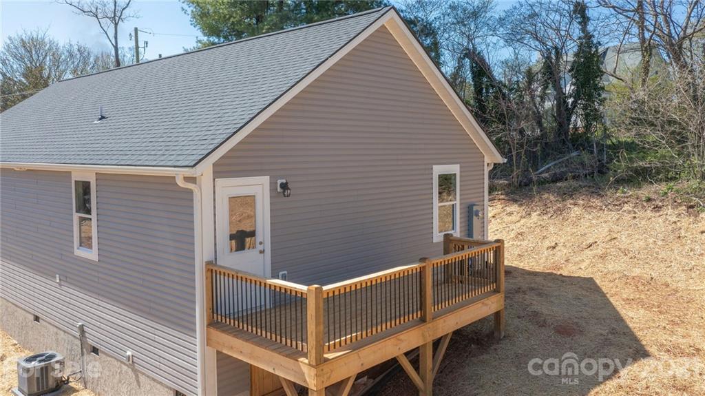 5 Sharptown Road Canton, NC 28716 - Photo 4 of 22 a view of house with backyard and trees