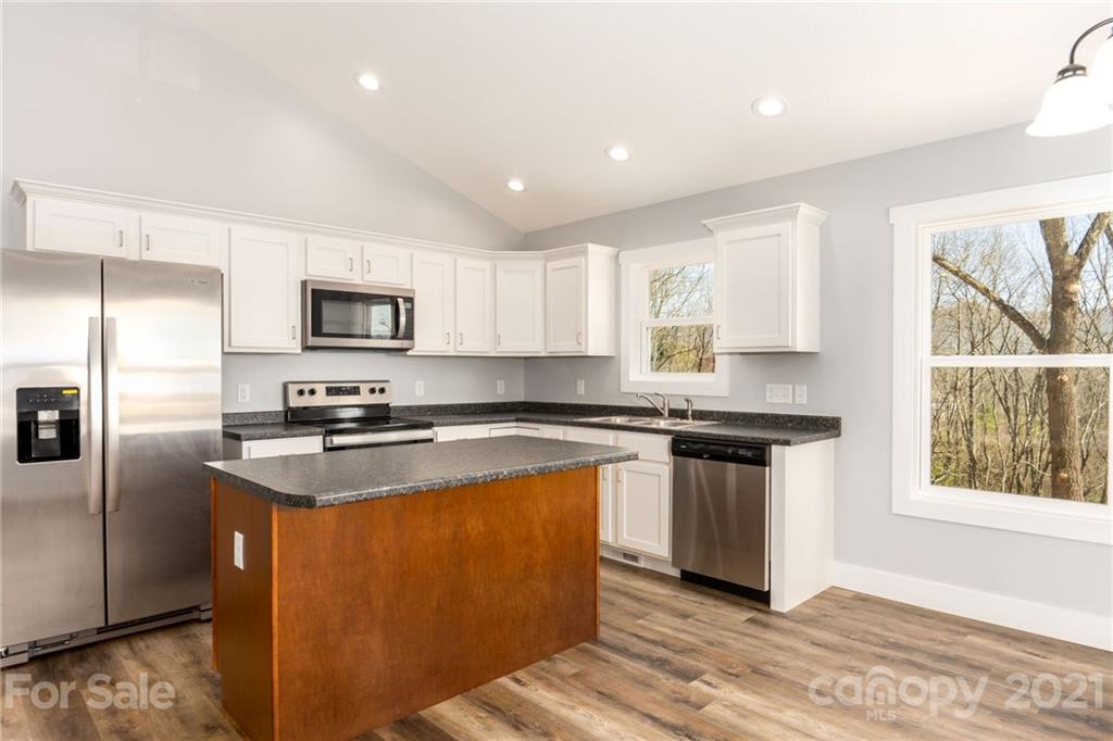 5 Sharptown Road Canton, NC 28716 - Photo 10 of 22 a kitchen with stainless steel appliances granite countertop a stove a sink and a microwave