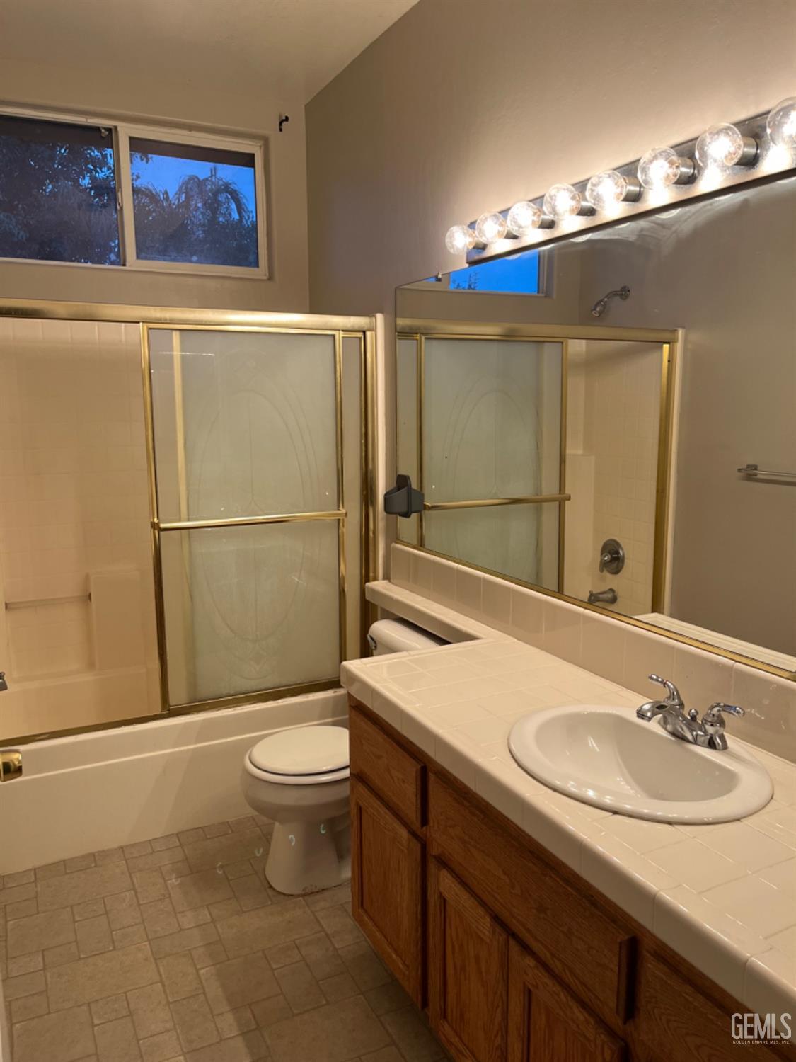 Undisclosed Address Bakersfield, CA 93311 - Photo 11 of 19 a bathroom with a sink and a mirror