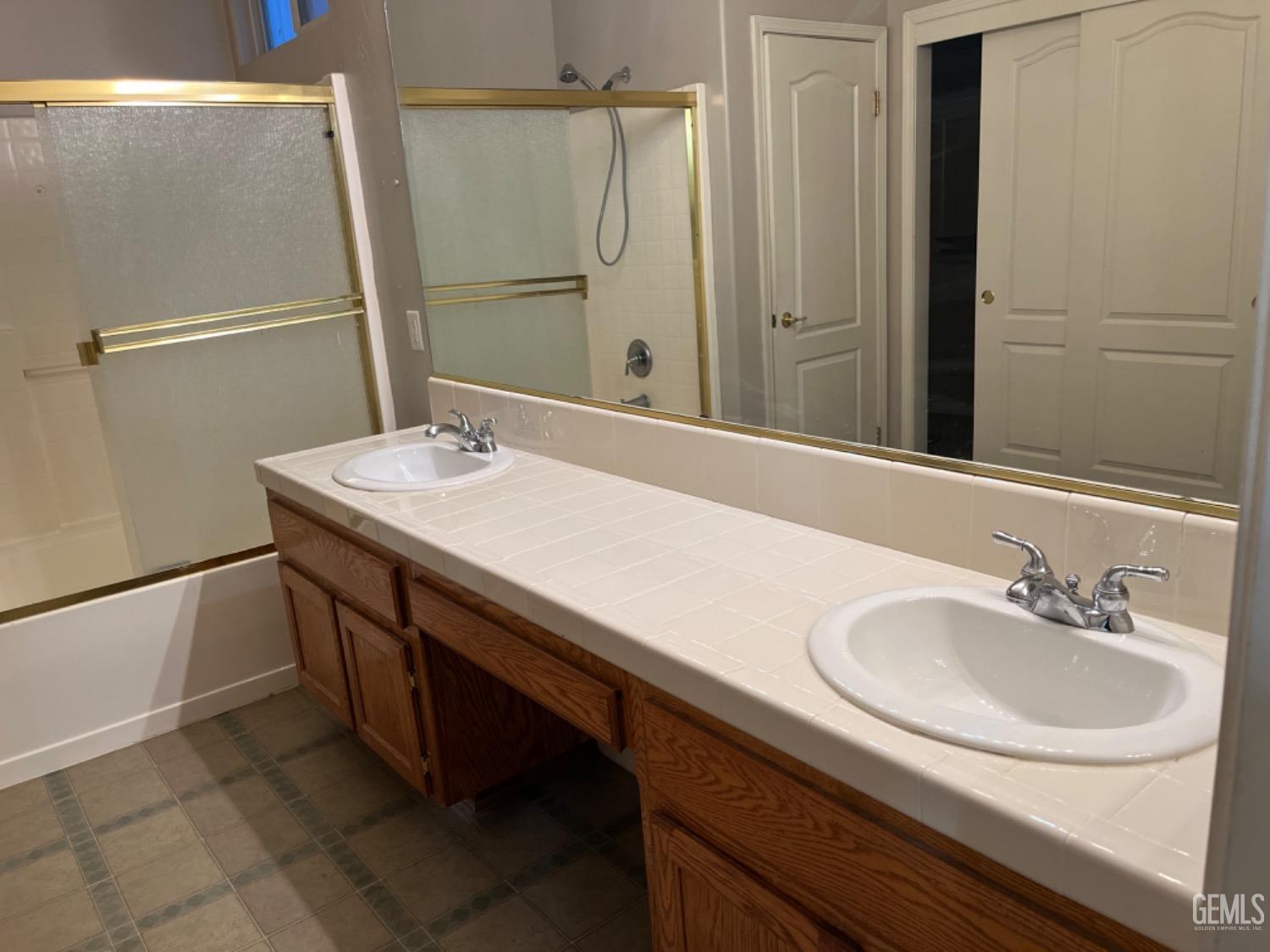 Undisclosed Address Bakersfield, CA 93311 - Photo 15 of 19 a bathroom with a sink and a mirror