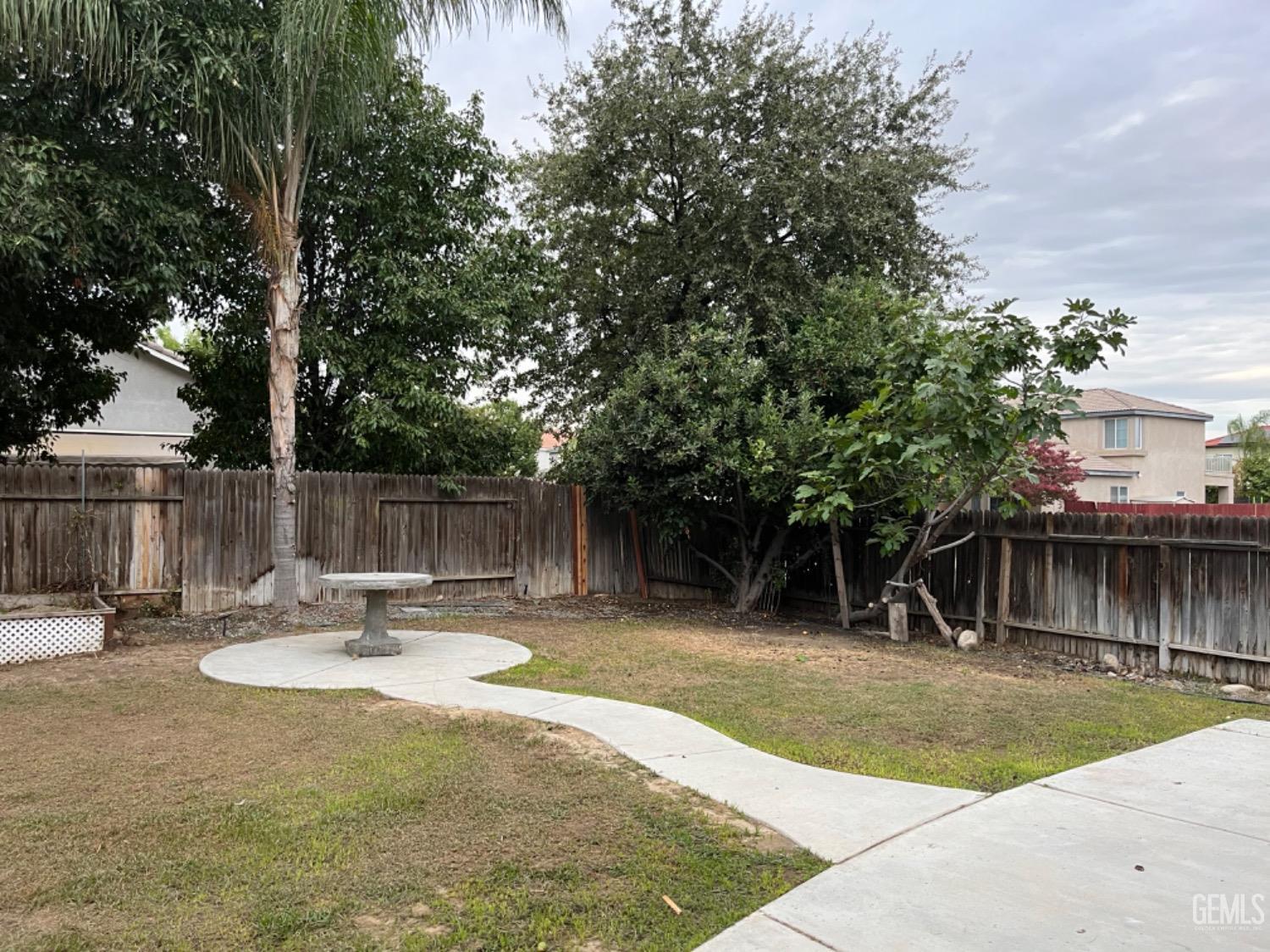 Undisclosed Address Bakersfield, CA 93311 - Photo 18 of 19 a swimming pool with outdoor seating and yard