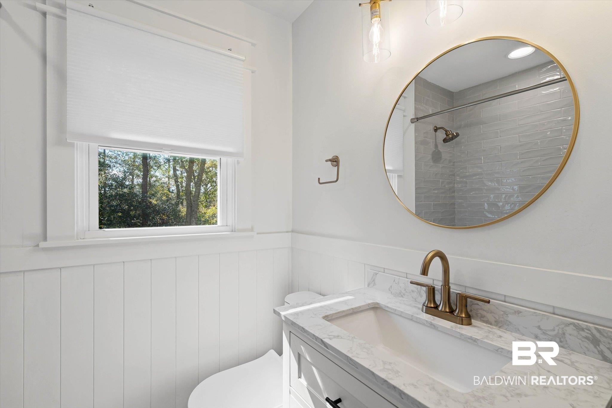 3933 Radnor Avenue Mobile, AL 36608 - Photo 20 of 36 Renovated Bathroom featuring wainscoting, vanity, and tiled shower