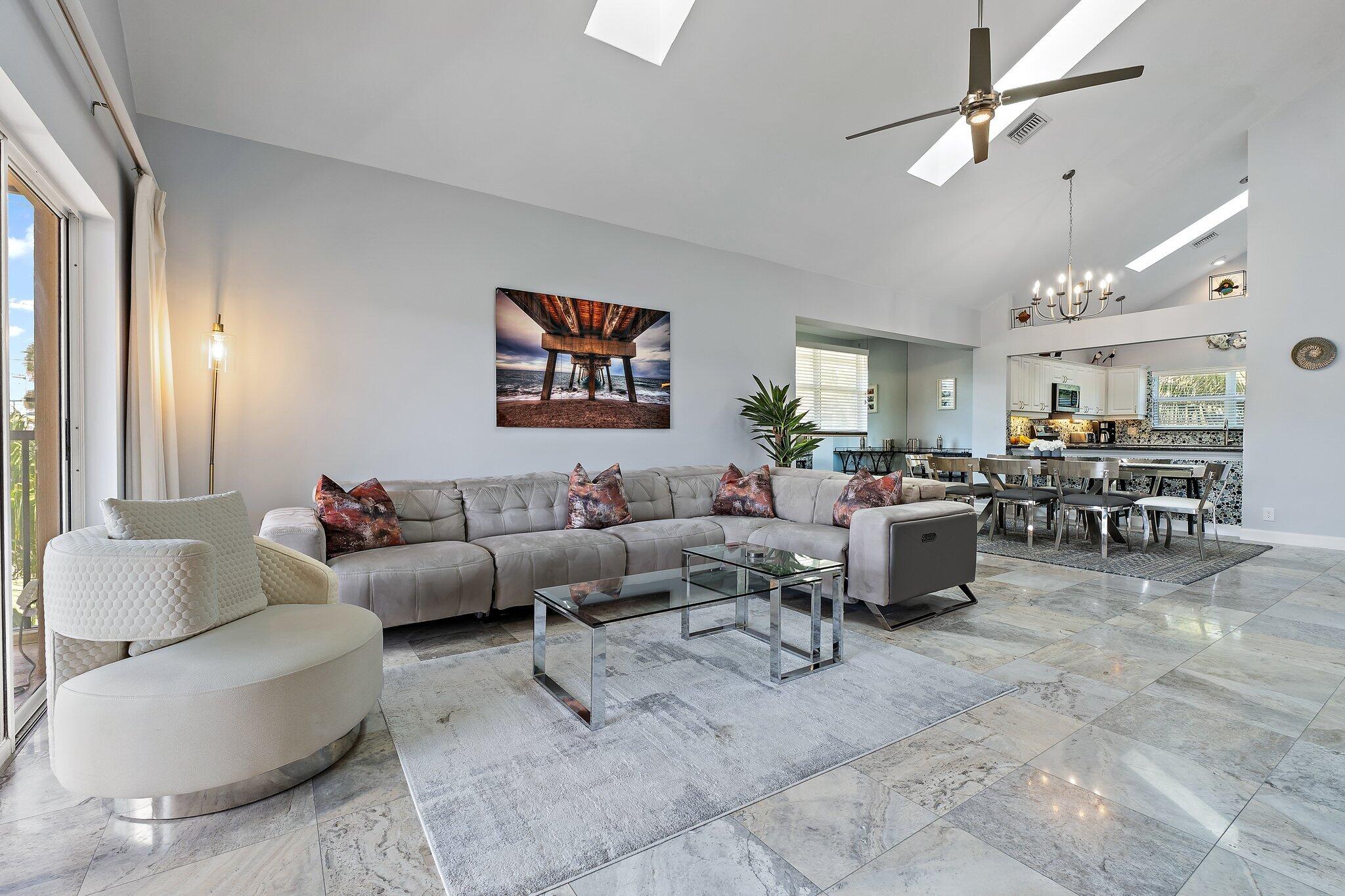 4161 U.S. Highway 1, Unit G3 Jupiter, FL 33477 - Photo 22 of 71 a living room with furniture kitchen view and a large window