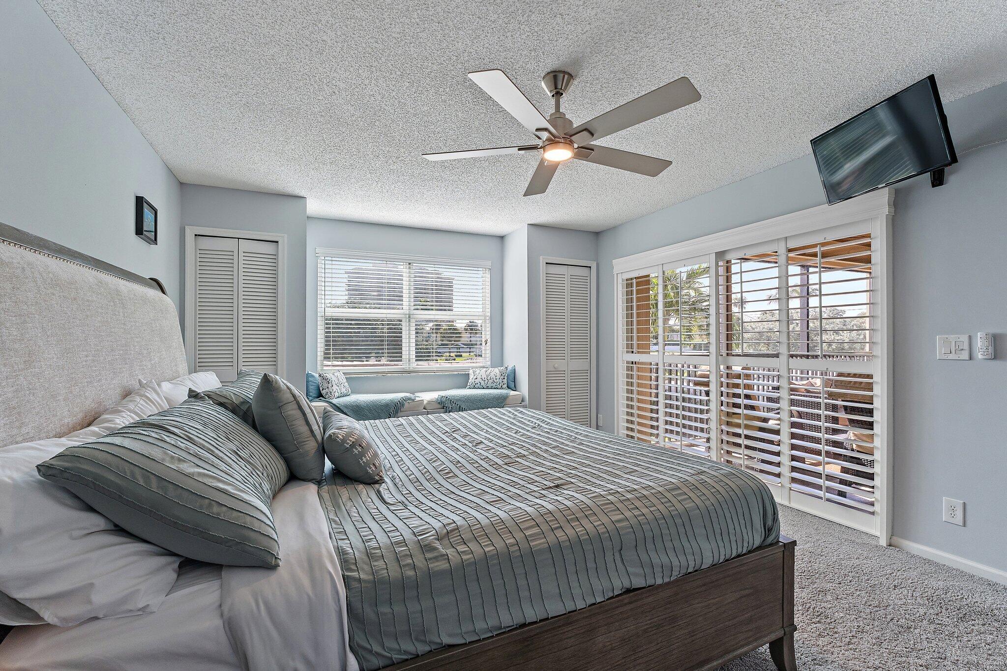 4161 U.S. Highway 1, Unit G3 Jupiter, FL 33477 - Photo 27 of 71 a bedroom with a large bed and a window