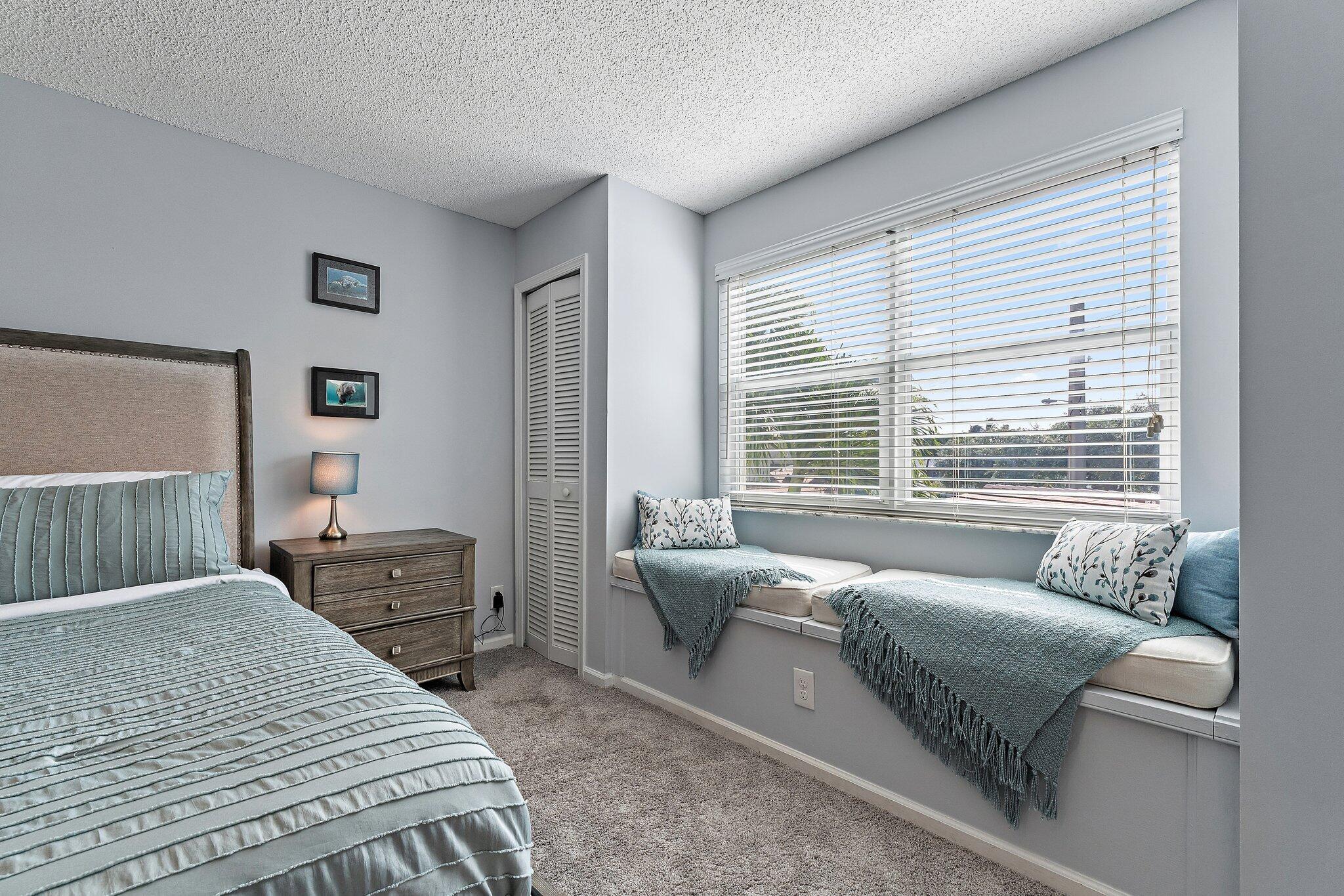 4161 U.S. Highway 1, Unit G3 Jupiter, FL 33477 - Photo 28 of 71 a bedroom with furniture and a large window