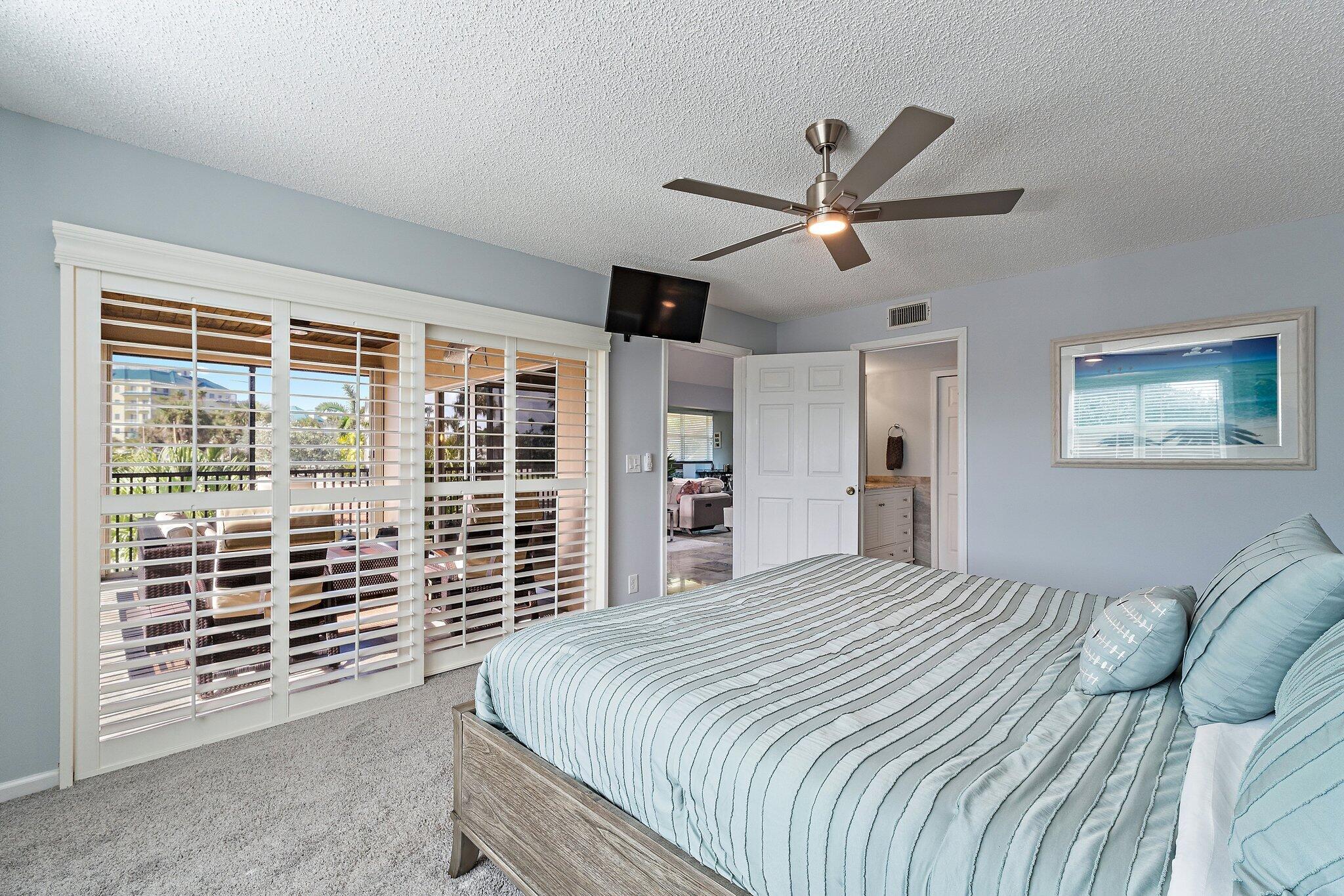 4161 U.S. Highway 1, Unit G3 Jupiter, FL 33477 - Photo 29 of 71 a bedroom with a large bed and a large window