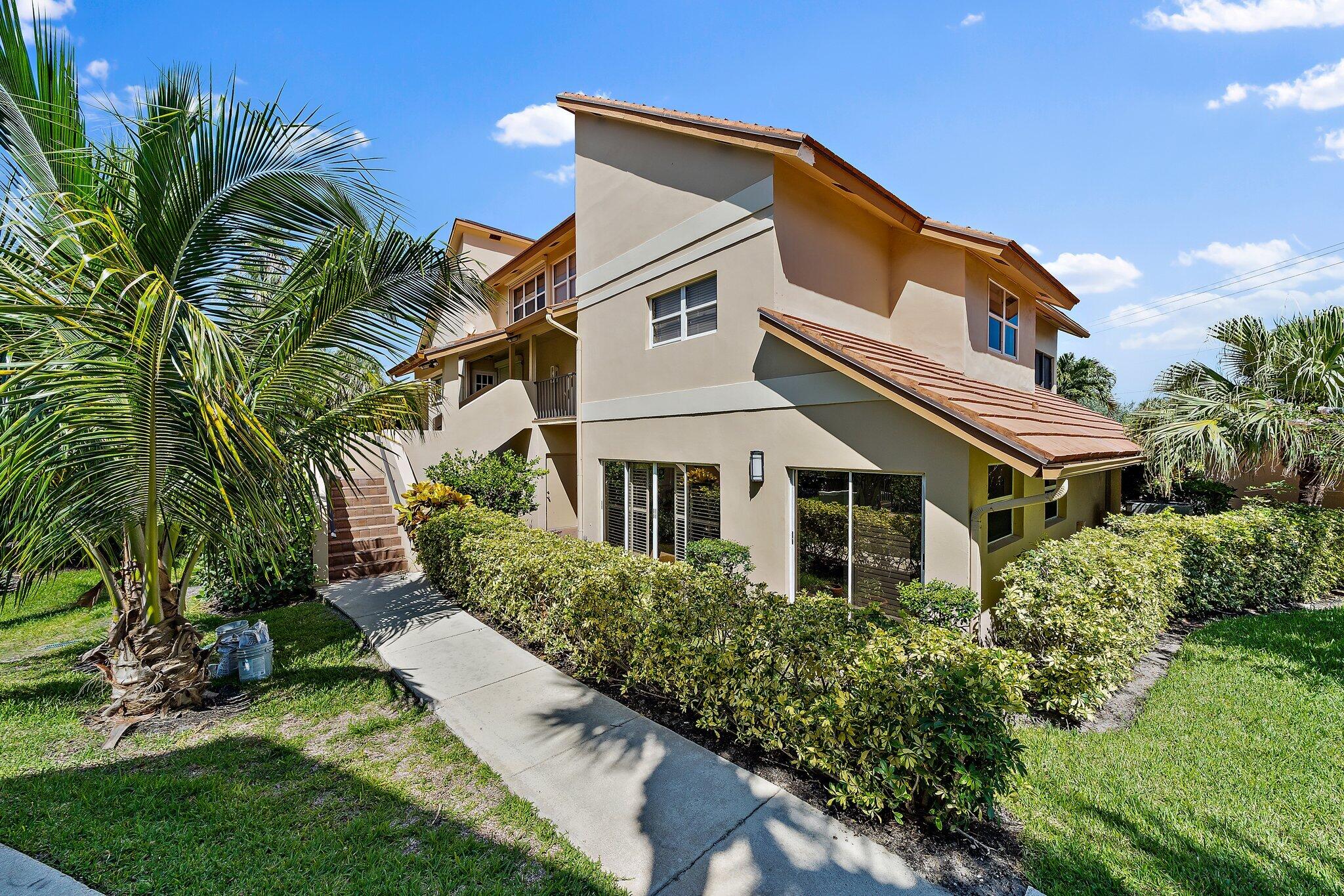 4161 U.S. Highway 1, Unit G3 Jupiter, FL 33477 - Photo 3 of 71 a view of a house with a yard