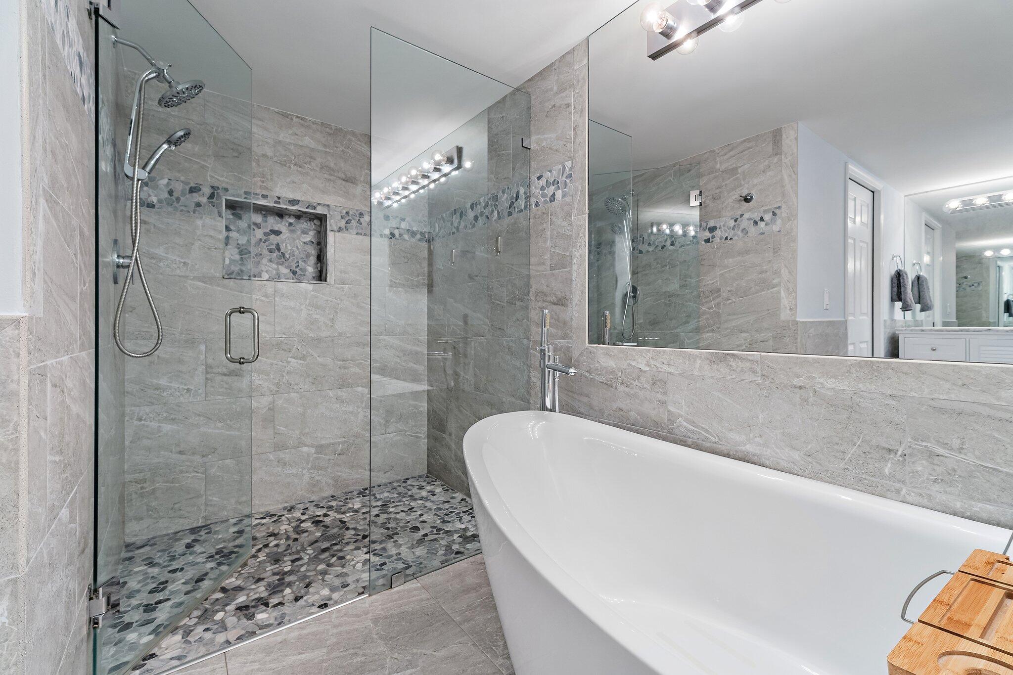 4161 U.S. Highway 1, Unit G3 Jupiter, FL 33477 - Photo 34 of 71 a spacious bathroom with a bathtub and shower
