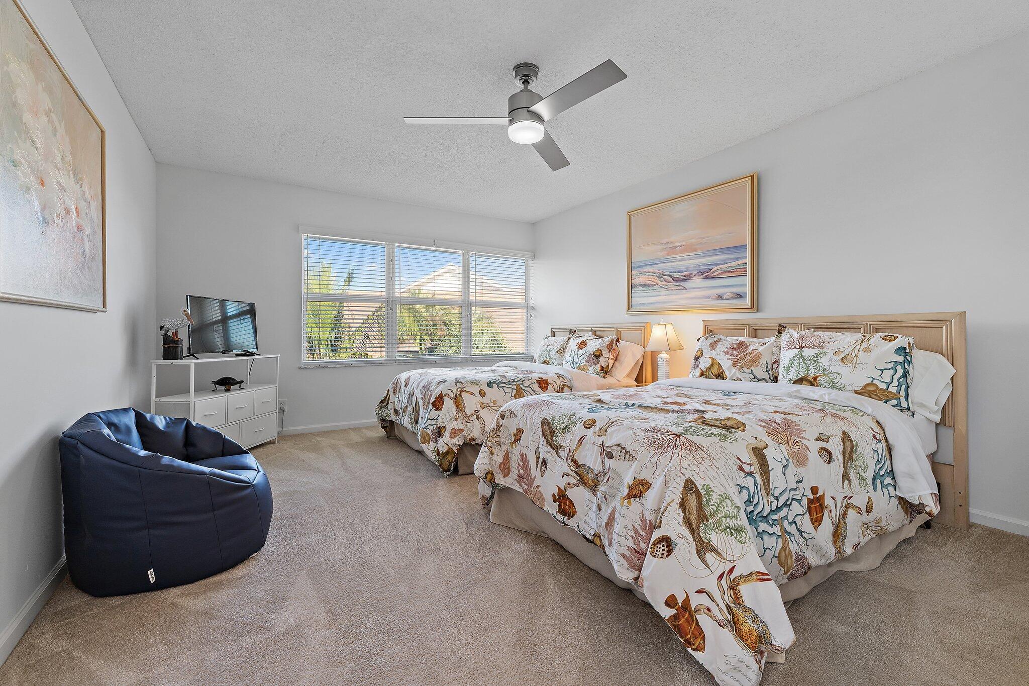 4161 U.S. Highway 1, Unit G3 Jupiter, FL 33477 - Photo 50 of 71 a bedroom with bed and window