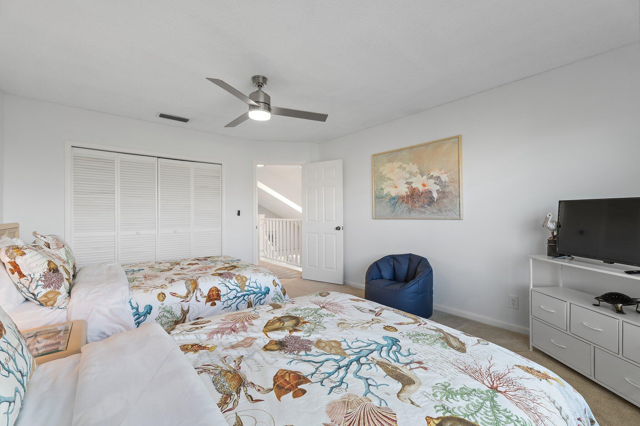 4161 U.S. Highway 1, Unit G3 Jupiter, FL 33477 - Photo 52 of 71 a bedroom with a bed and a television