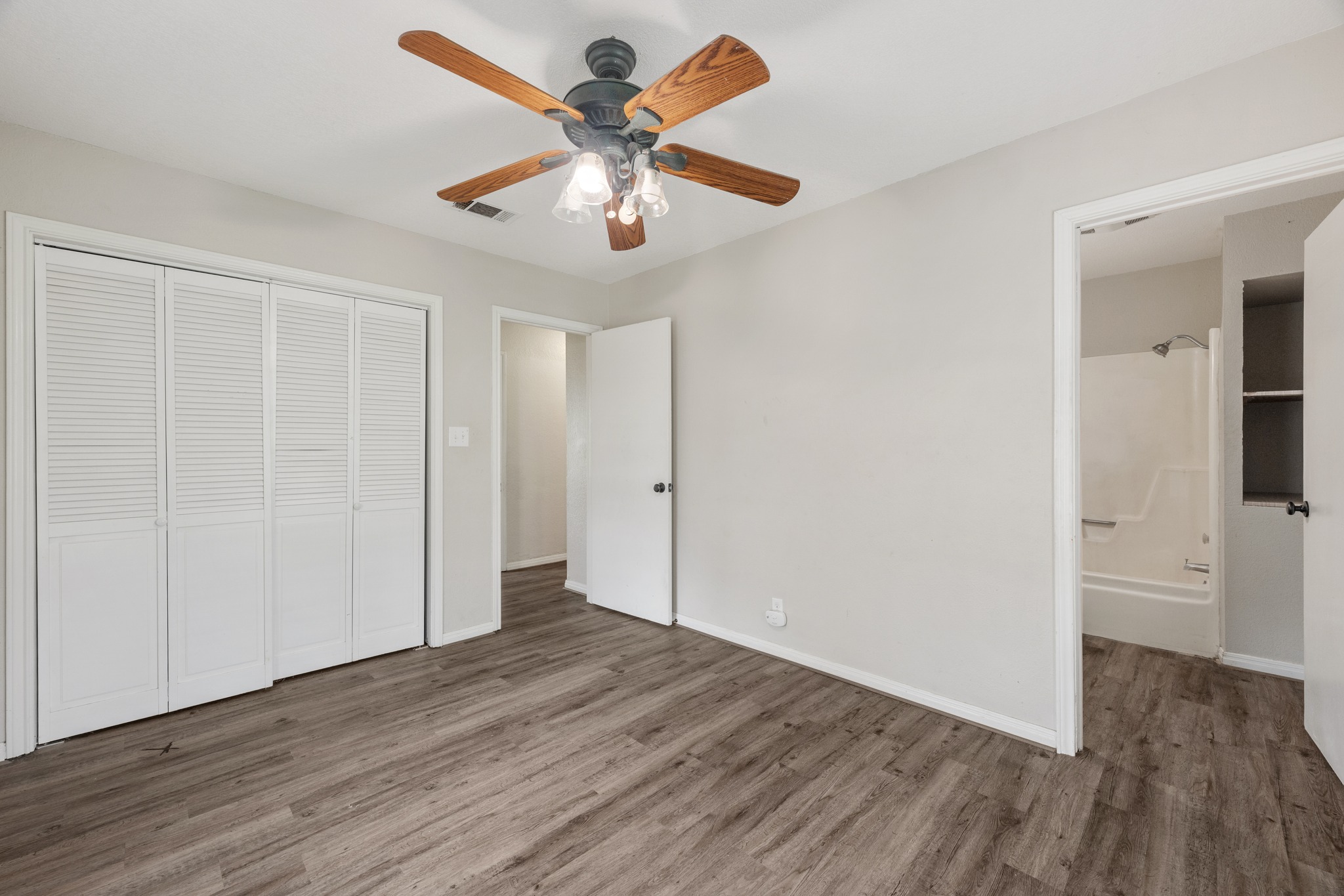 110 Skyview Terrace Leander, TX 78641 - Photo 16 of 26 Light-toned walls complement wood-finish flooring in this interior space