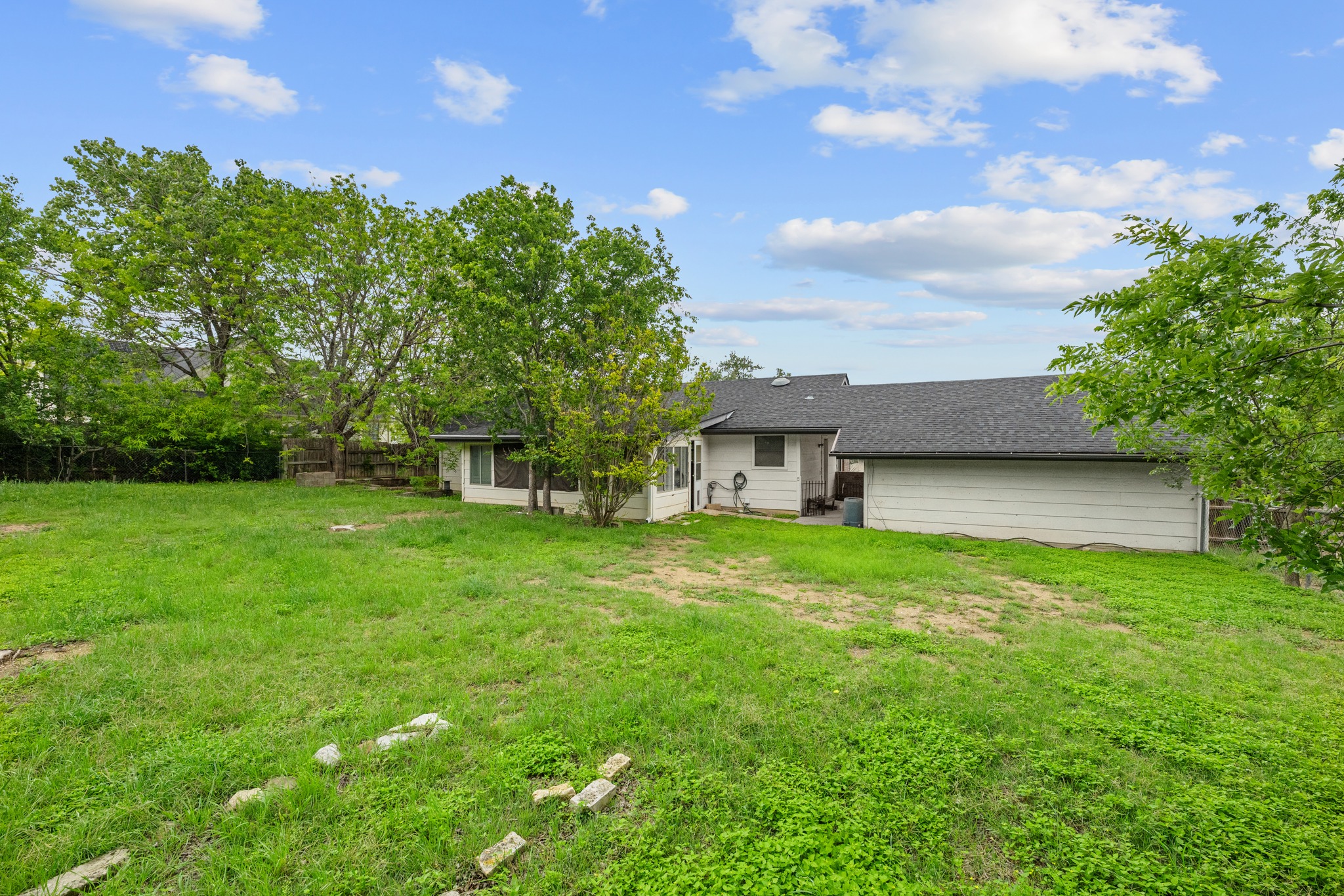 110 Skyview Terrace Leander, TX 78641 - Photo 25 of 26 Spacious backyard featuring a sloped lawn and mature trees