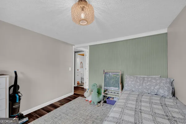 a bedroom with furniture and a window