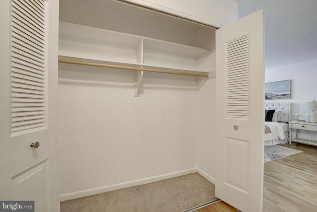 a view of a room with shelves on the wall