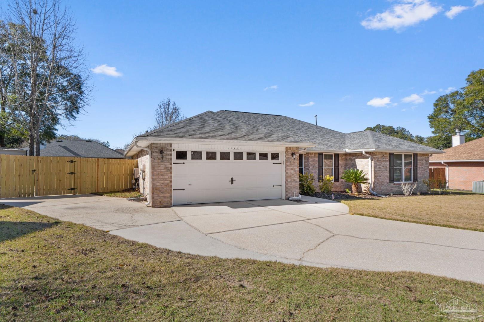 11841 Old Course Road Cantonment, FL 32533 - Photo 2 of 46 a view of a house with a patio