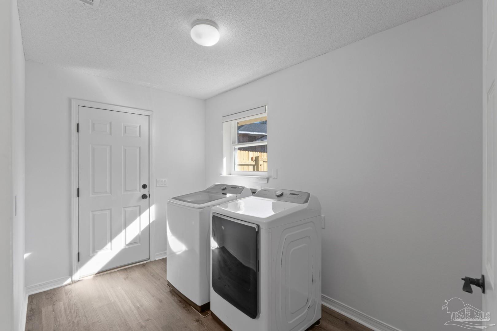 11841 Old Course Road Cantonment, FL 32533 - Photo 21 of 46 a utility room with dryer and washer