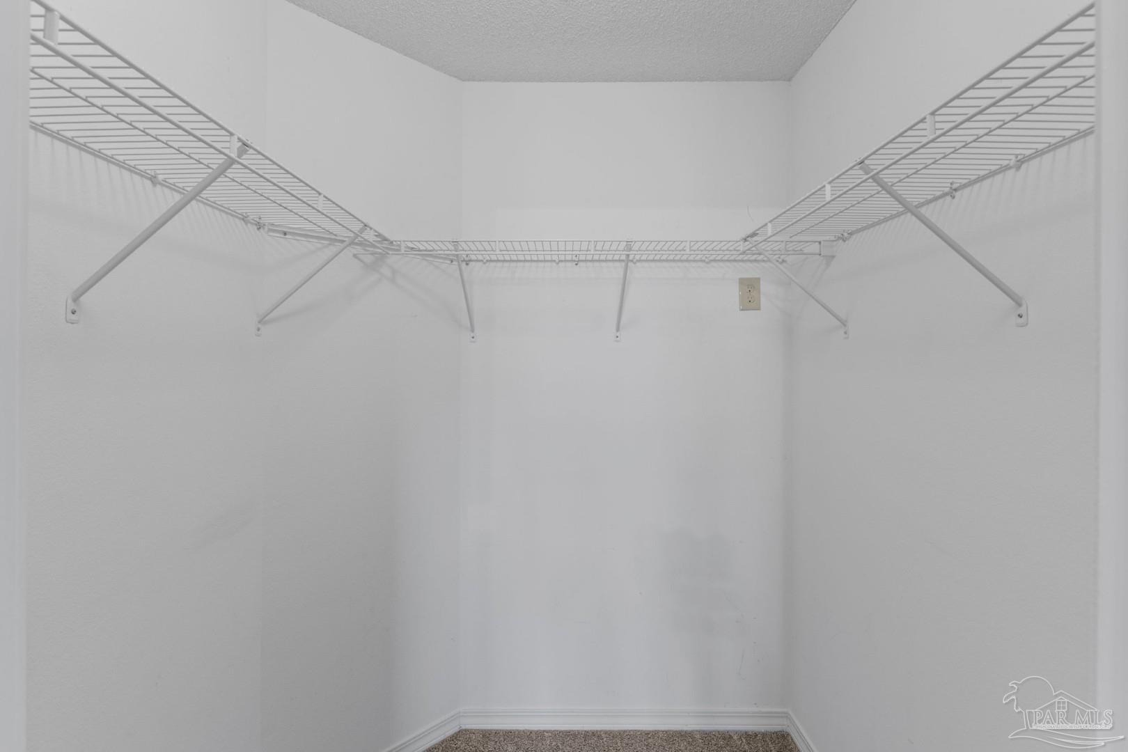 11841 Old Course Road Cantonment, FL 32533 - Photo 32 of 46 a view of a room with racks on the wall