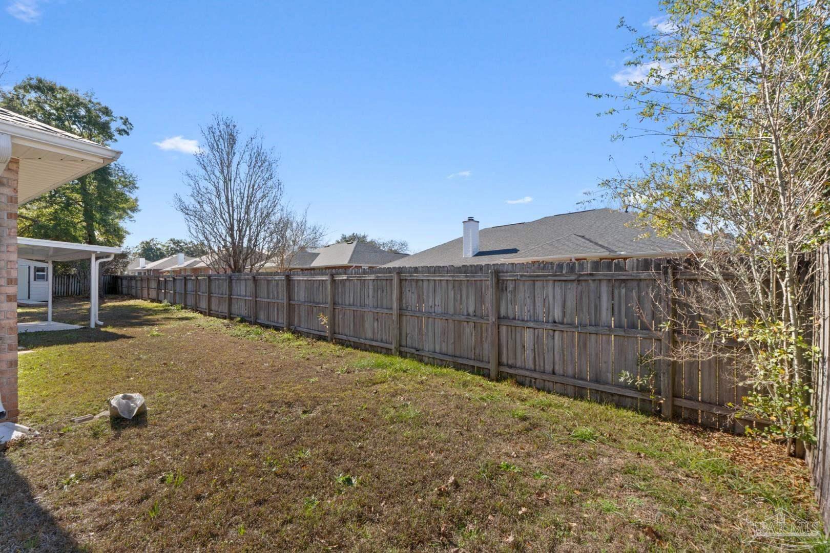 11841 Old Course Road Cantonment, FL 32533 - Photo 37 of 46 a view of a backyard with wooden fence